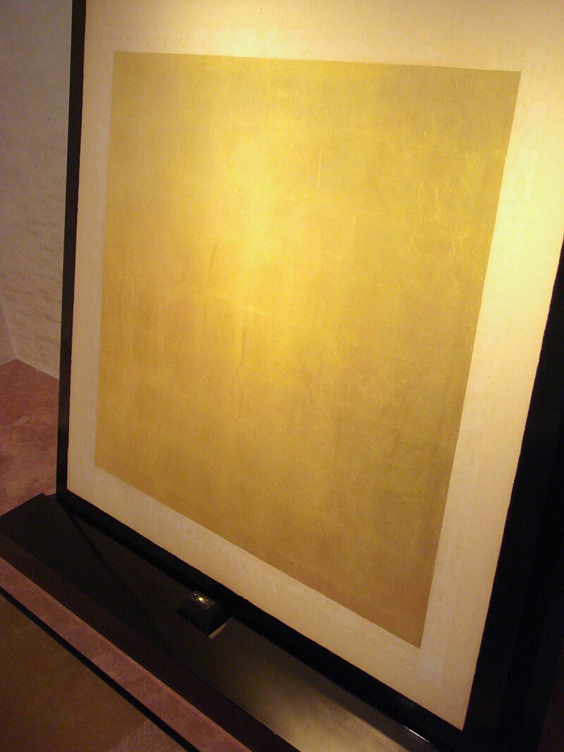 Small gold nugget and gold leaf