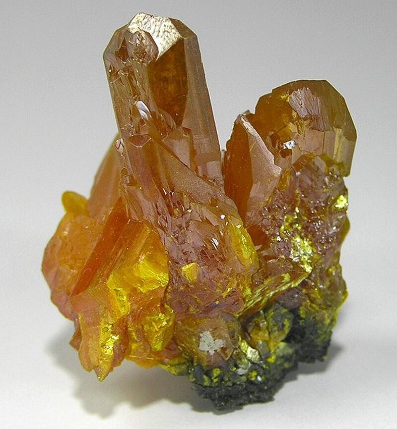 Golden-yellow orpiment mineral crystals